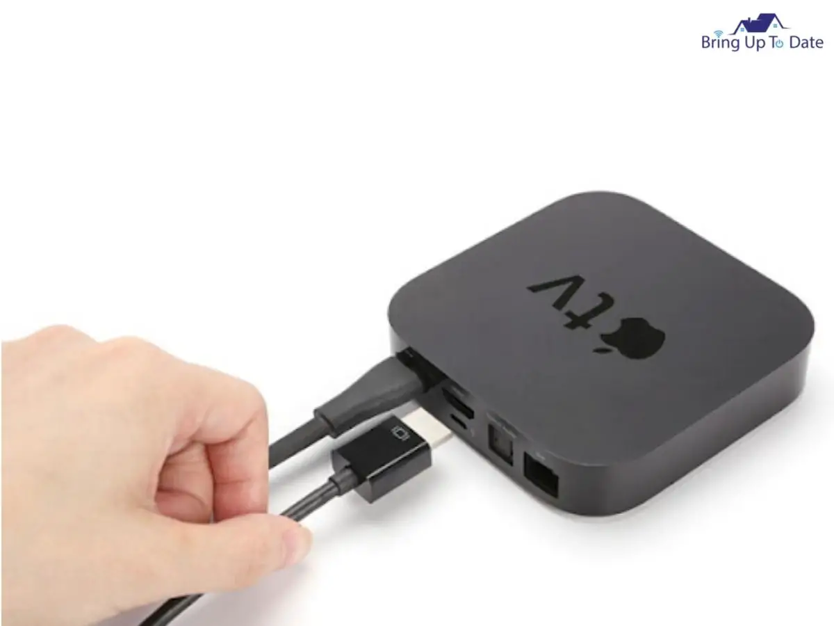 Take the power cord out of the Apple Tv